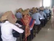 Ученики колледжа писали экзамен по химии с коробками на голове